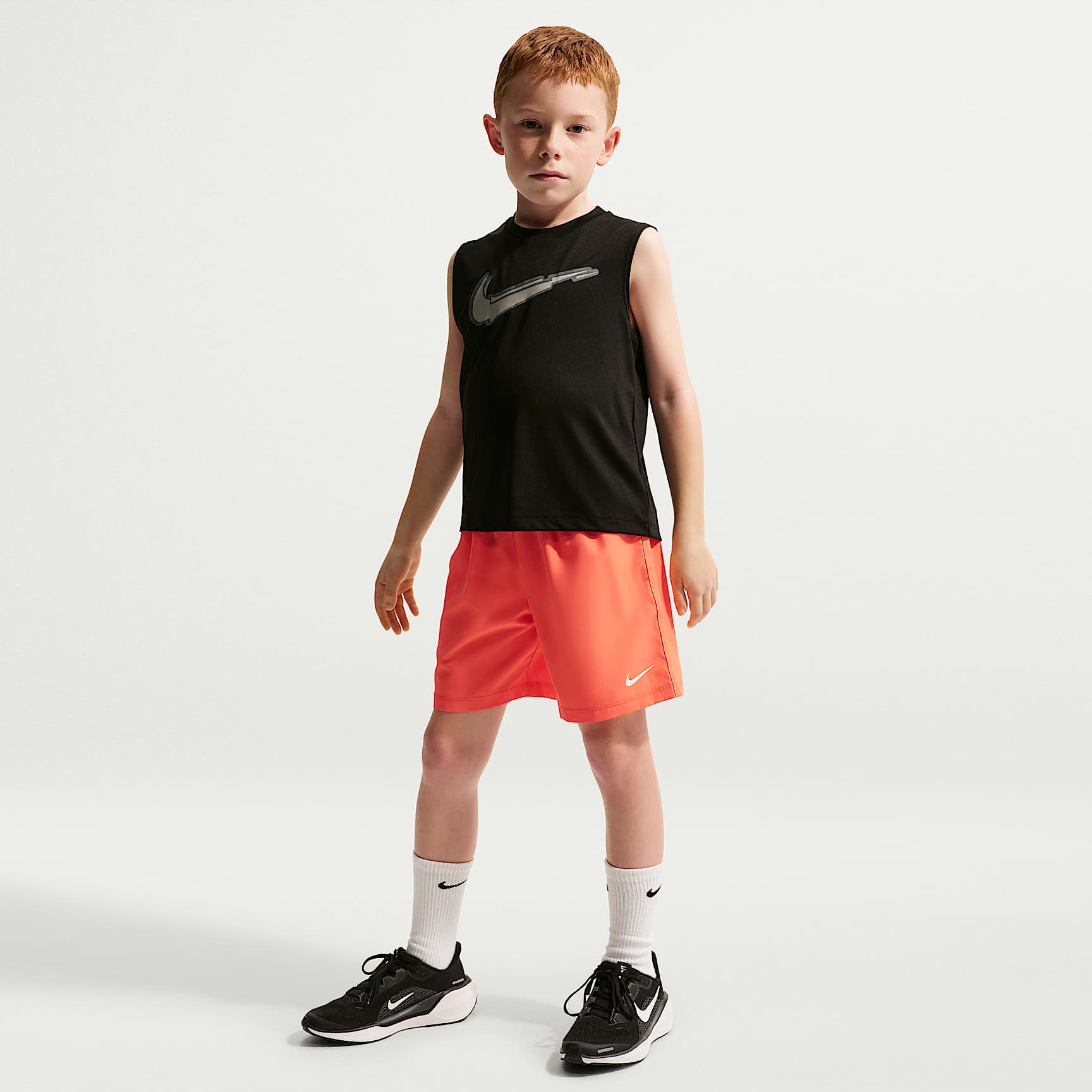 Shorts de tejido Woven Dri-FIT para niños talla pequeña Nike Icon – Naranja césped – vista 1