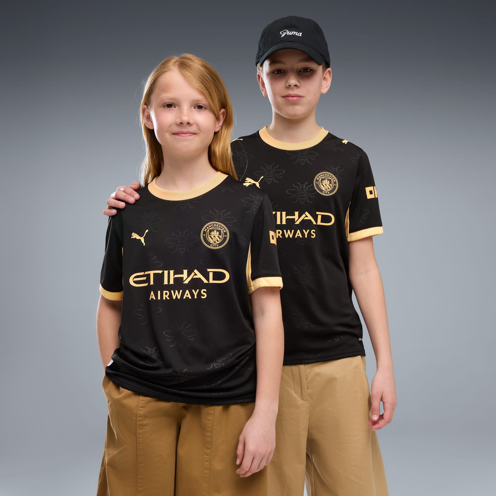 Jersey de futbol juvenil Manchester City visitante – PUMA Black-Flaxen – vista 1