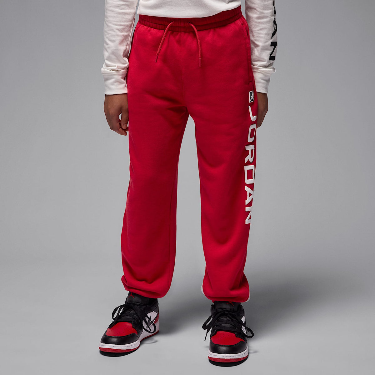 Pants de tejido Fleece Baseline para niños talla grande Jordan Essentials – Rojo – vista 1