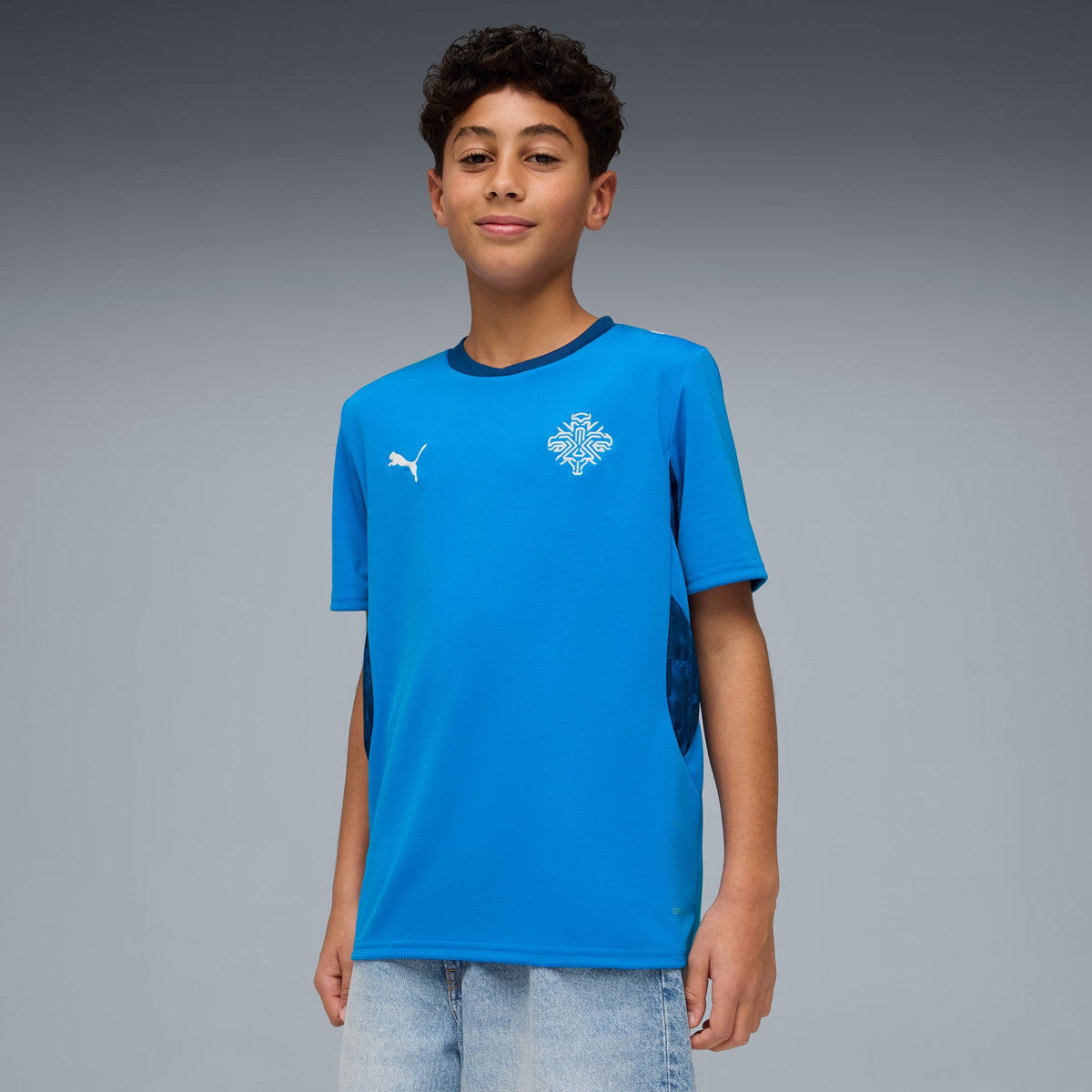 Playera de fútbol juvenil Islandia local – Electro Royal-PUMA White – vista 1