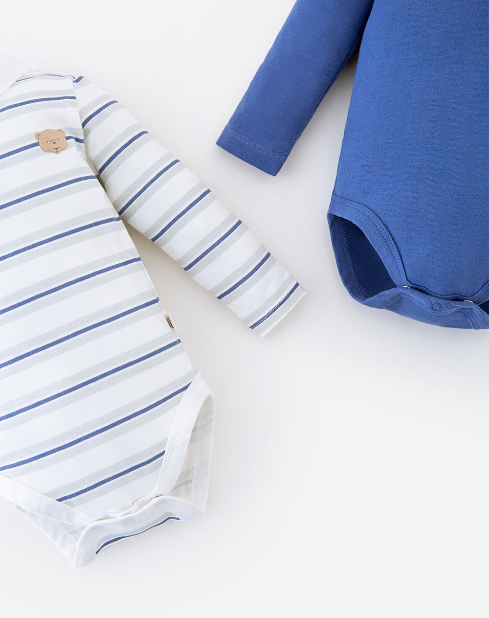 Paquete de dos bodies Babyfresh de manga larga, azul liso y rayas